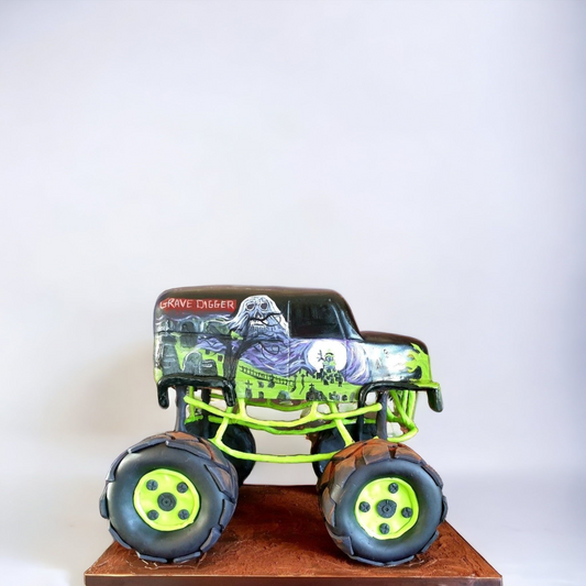 Grave Digger monster truck cake made from rich chocolate cake, featuring realistic details with iconic spooky graphics, green chassis, and oversized wheels, displayed on a textured brown base against a light background